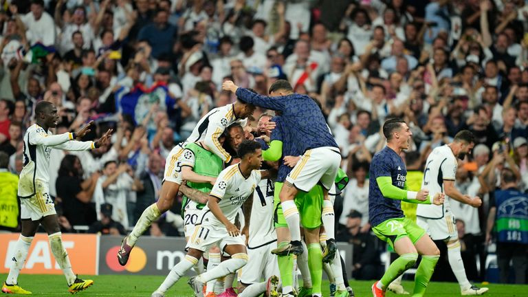 Real Madrid players spilled onto the pitch after the striker's second goal