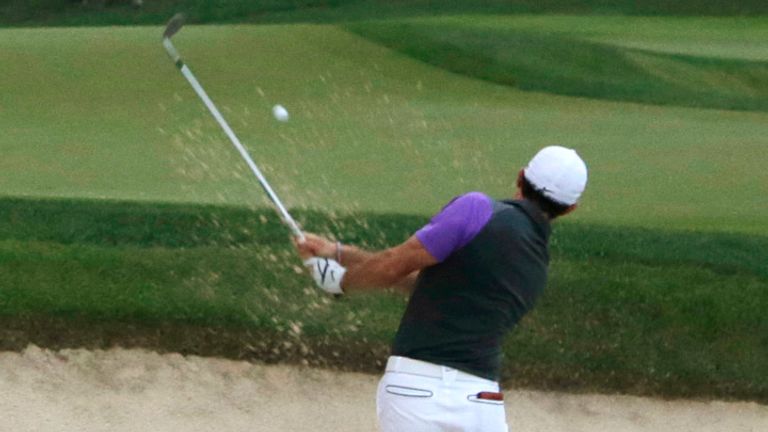 Rory McIlroy, of Northern Ireland, hits out of the bunker on the 18th hole during the final round of the PGA Championship golf tournament at Valhalla Golf Club on Sunday, Aug. 10, 2014, in Louisville, Ky. (AP Photo/Jeff Roberson) 