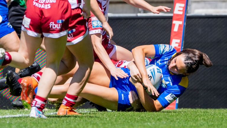 Picture by Allan McKenzie/SWpix.com - 19/05/2024 - Rugby League - Betfred Women's Challenge Cup Semi Final - Leeds Rhinos v Wigan Warriors - The Totally Wicked Stadium, St Helens, England - Leeds' Ruby Enright scores a try against Wigan.