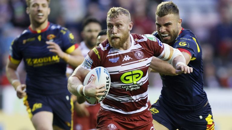 Wigan Warriors' Luke Thompson on their way to scoring their side's first try of the game against Catalans Dragons