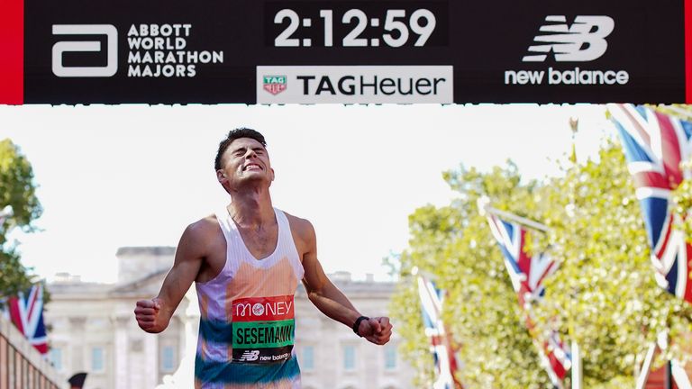 Phil Sesemann crosses the finsih line during the Virgin Money London Marathon in 2021. 