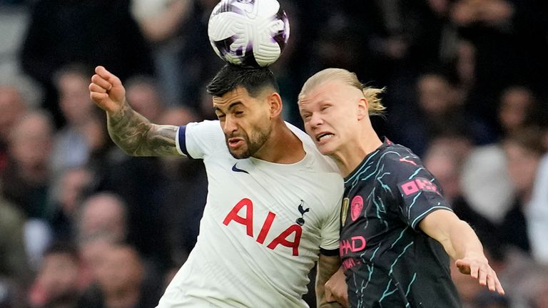 Tottenham's Cristian Romero, left, and Manchester City's Erling Haaland challenge for the ball during the English Premier League soccer match between Tottenham Hotspur and Manchester City at Tottenham Hotspur Stadium in London, Tuesday, May 14, 2024.(AP Photo/Kin Cheung)