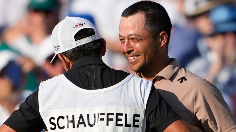 Xander Schauffele hugs his caddie Austin Kaiser after winning the final round of the PGA Championship golf tournament at the Valhalla Golf Club, Sunday, May 19, 2024, in Louisville, Ky. (AP Photo/Matt York)