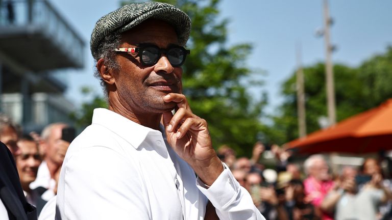 FILE - Former French tennis player Yannick Noah attends the inauguration of a fresco retracing his life, on the occasion of the 40th anniversary of his victory at Roland Garros in 1983, on day one of the Roland-Garros Open tennis tournament in Paris