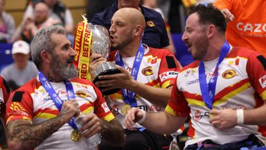 Jeremy Bourson and his Catalans team-mates celebrate with the Wheelchair Challenge Cup