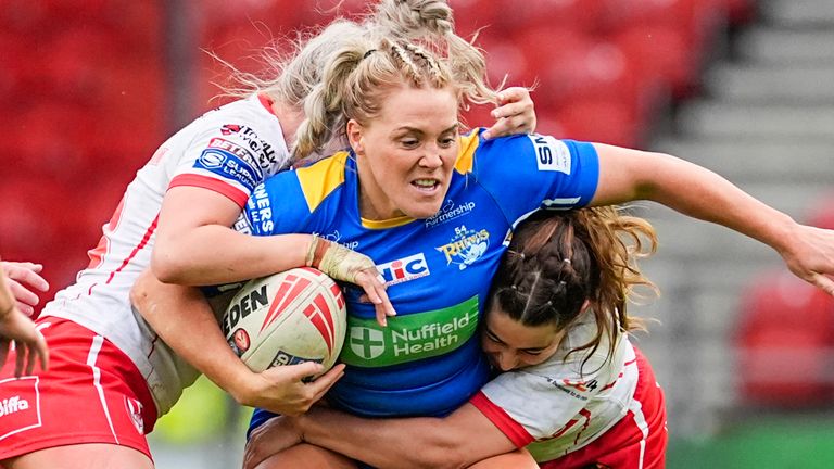 Picture by Olly Hassell/SWpix.com - 24/05/2024 - Rugby League - Betfred Women's Super League Round 4 - St Helens v Leeds Rhinos - The Totally Wicked Stadium, St Helens, England - Amy Hardcastle of Leeds is tackled by St Helens