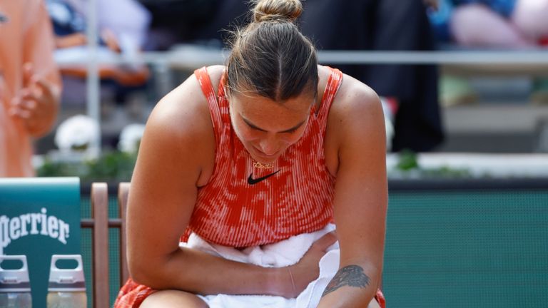 Aryna Sabalenka of Belarus waits for medical; assistance during her quarterfinal match of the French Open tennis tournament against Russia's Mirra Andreeva at the Roland Garros stadium in Paris, Wednesday, June 5, 2024. (AP Photo/Aurelien Morissard)