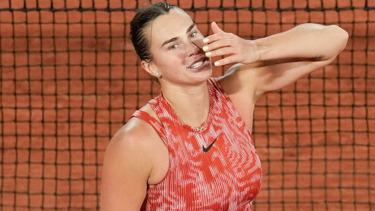 Aryna Sabalenka of Belarus blows a kiss to cheering tennis fans after winning her third round match of the French Open tennis tournament against Spain's Paula Badosa at the Roland Garros stadium in Paris, Saturday, June 1, 2024. (AP Photo/Christophe Ena)