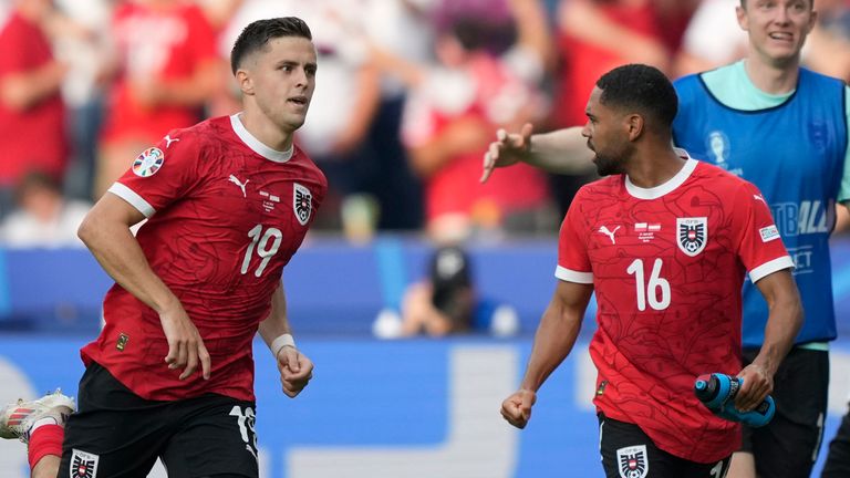 Austria's Christoph Baumgartner, left, celebrates after scoring his side's second goal