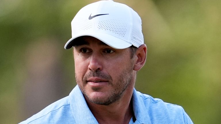 Brooks Koepka waves after making a putt on the second hole during the first round of the U.S. Open golf tournament Thursday, June 13, 2024, in Pinehurst, N.C. (AP Photo/George Walker IV)