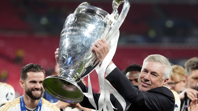 Carlo Ancelotti lifts the Champions League trophy