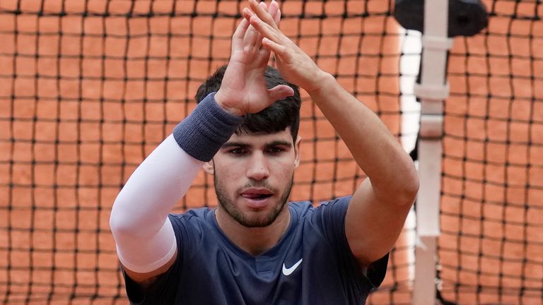 Spain's Carlos Alcaraz celebrates as he won his fourth round match of the French Open tennis tournament against Canada's Felix Auger-Aliassime at the Roland Garros stadium in Paris, Sunday, June 2, 2024. (AP Photo/Christophe Ena)