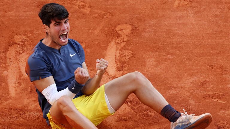 Carlos Alcaraz of Spain celebrates winning match point against Alexander Zverev of Germany during the Men's Singles Final match on Day 15 of the 2024 French Open at Roland Garros on June 09, 2024 in Paris, France. (Photo by Clive Brunskill/Getty Images)