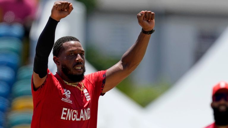 England's Chris Jordan, left, celebrates the dismissal of United States' Noshtush Kenjige during the ICC Men's T20 World Cup cricket match between the United States and England at Kensington Oval in Bridgetown, Barbados, Sunday, June 23, 2024. (AP Photo/Ricardo Mazalan)