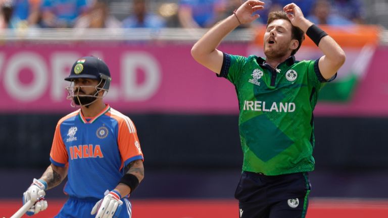 Ireland's Mark Adair, right, reacts after a delivery to India's captain Rohit Sharma, not in picture