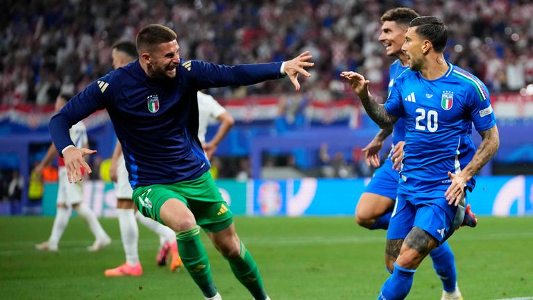 Italy's Mattia Dzacagni, right, celebrates with teammates after scoring a goal during the Group B match between Croatia and Italy at the Euro 2024 soccer tournament in Leipzig, Germany, Monday, June 24, 2024. (AP Photo/Petr David Josek )