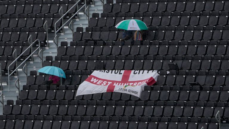 Fans remain in the stands as rain interrupts an ICC Men's T20 World Cup cricket match between Scotland and England at Kensington Oval in Bridgetown, Barbados, Tuesday, June 4, 2024. (AP Photo/Ricardo Mazalan)