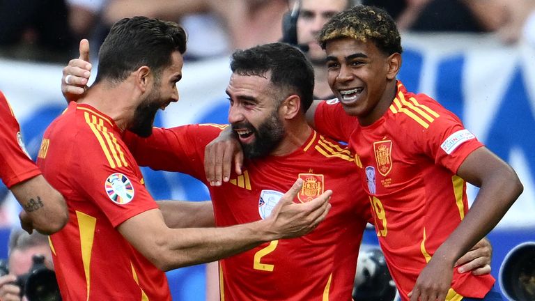 Dani Carvajal celebrates with his team-mates after scoring Spain's third goal against Croatia