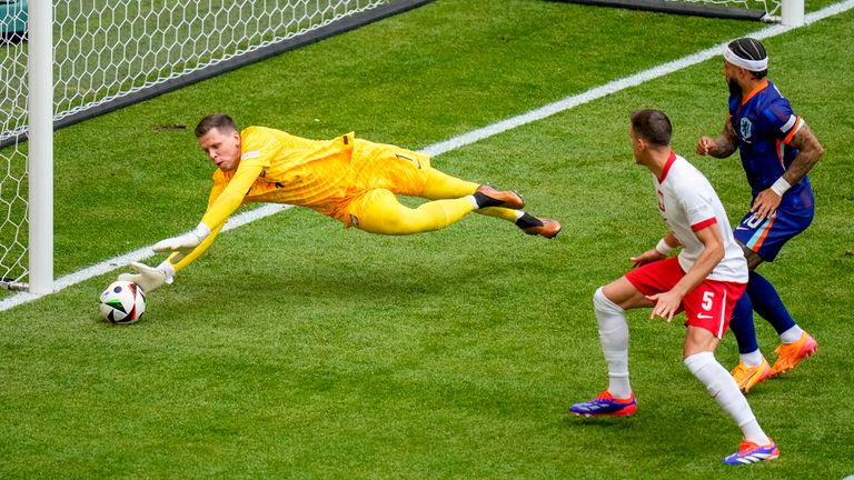 Wojciech Szczesny makes an early save to deny the Dutch