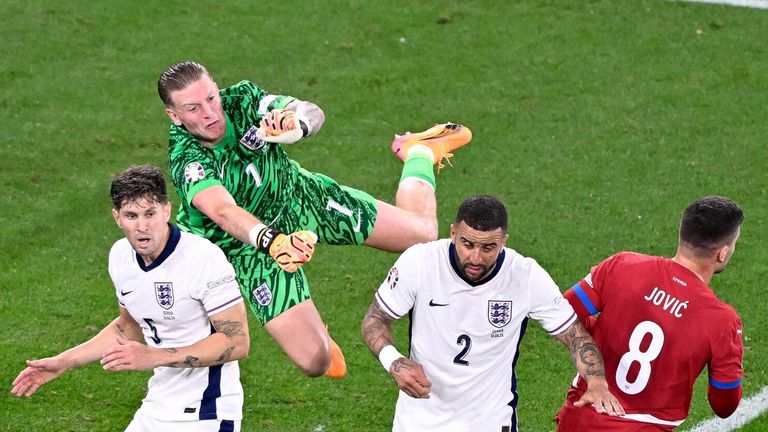 Jordan Pickford punches clear to end a Serbia attack