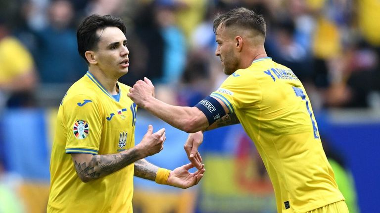 Mykola Shaparenko celebrates with team-mate Andriy Yarmolenko after scoring Ukraine's equaliser against Slovakia