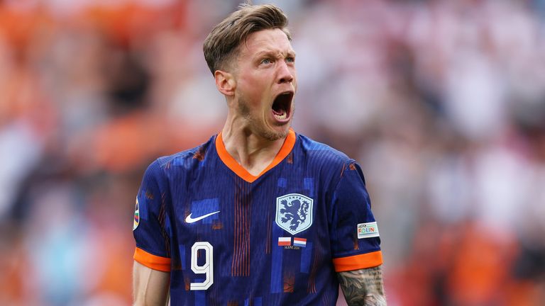 Wout Weghorst roars in celebration after scoring the Netherlands' second goal against Poland