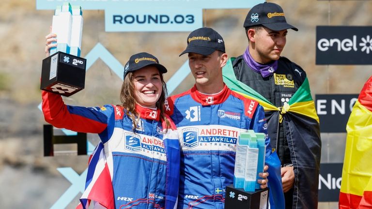 MAY 13: Catie Munnings (GBR), Andretti Altawkilat Extreme E, and Timmy Hansen (SWE), Andretti Altawkilat Extreme E, 2nd position, with their trophies on the podium during the Scotland X-Prix on May 13, 2023. (Photo by Sam Bloxham / LAT Images) (MAY 13
