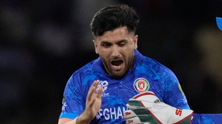 Afghanistan's Fazalhaq Farooqi celebrates a goal from Finn Allen 