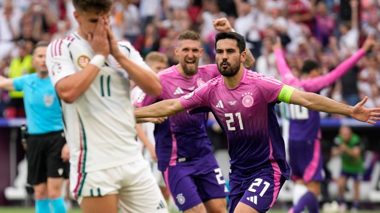 Germany's Ilkay Gundogan, right, celebrates after scoring his side's second goal against Hungary