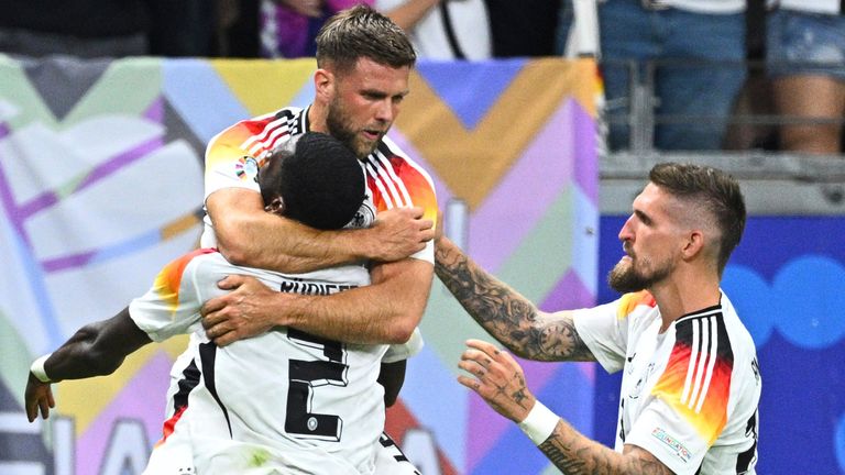 23 June 2024, Hesse, Frankfurt/M.: Soccer, UEFA Euro 2024, European Championship, Switzerland - Germany, Preliminary round, Group A, Matchday 3, Frankfurt Arena, Germany's Niclas F'llkrug (M) celebrates the 1-1 draw with Antonio R'diger (l) and Robert Andrich. Photo by: Tom Weller/picture-alliance/dpa/AP Images