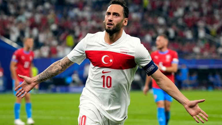 Turkey's Hakan Calhanoglu (10) celebrates after scoring the opening goal during a Group F match between Czech Republic and Turkey at the Euro 2024 soccer tournament in Hamburg, Germany, Wednesday, June 26, 2024. (AP Photo/Petr David Josek)