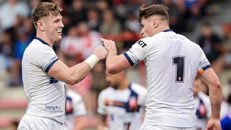 Picture by Alex Whitehead/SWpix.com - 29/06/2024 - Rugby League - International Test - France vs England - Stade Ernest-Wallon, Toulouse, France - Jack Welsby of England celebrates with Harry Newman after scoring a try.