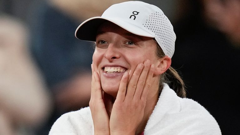 Poland's Iga Swiatek is all smiles as the audience sings Happy Birthday after her third round match of the French Open tennis tournament at the Roland Garros stadium in Paris, Friday, May 31, 2024. (AP Photo/Christophe Ena)