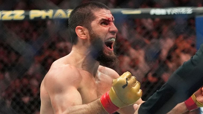 A bloodied Islam Makhachev celebrates after defeating Dustin Poirier in their lightweight title fight at UFC 302 in Newark (AP Photo/Frank Franklin II)