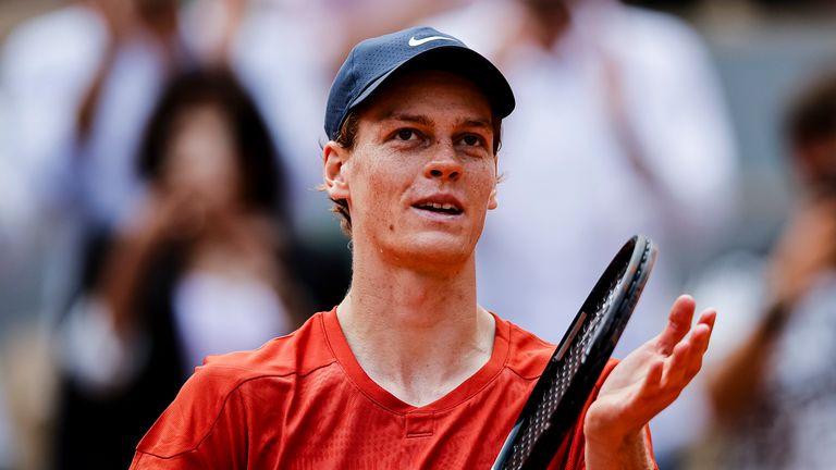 Jannik Sinner applauds the Roland Garros crowd after his quarter-final win over Grigor Dimitrov
