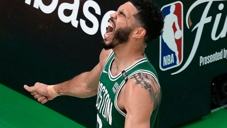 Boston Celtics' Jayson Tatum celebrates after scoring a goal in the first half of Game 5 of the NBA basketball finals against the Dallas Mavericks, Monday, June 17, 2024, in Boston.  (AP Photo/Michael Dwyer)