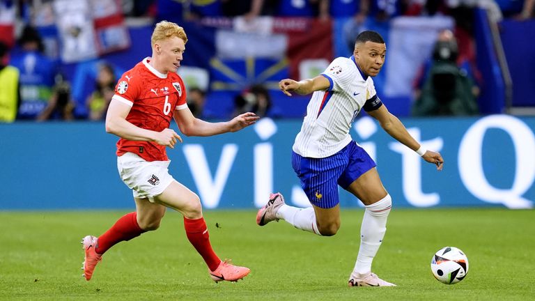 France's Kylian Mbappe (right) and Austria's Nicolas Seiwald battle for the ball during the UEFA Euro 2024 Group D match at the Dusseldorf Arena in Dusseldorf, Germany. Picture date: Monday June 17, 2024