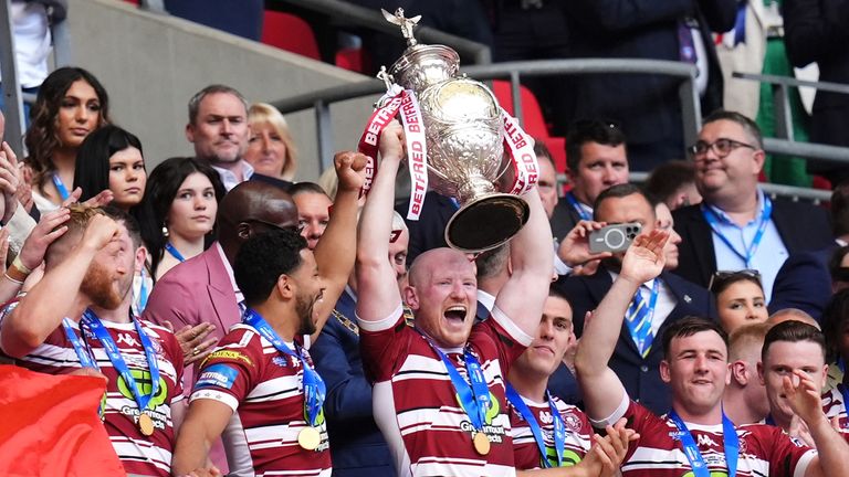 Wigan captain Liam Farrell lifts the Challenge Cup after Wigan's 18-8 victory over Warrington at Wembley