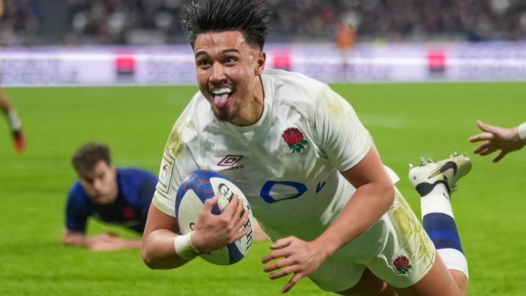 England's Marcus Smith reacts as he scores a try during the Six Nations rugby union international match between France and England at Groupama Stadium, Lyon, France, Saturday, March 16, 2024. (AP Photo/Laurent Cipriani)