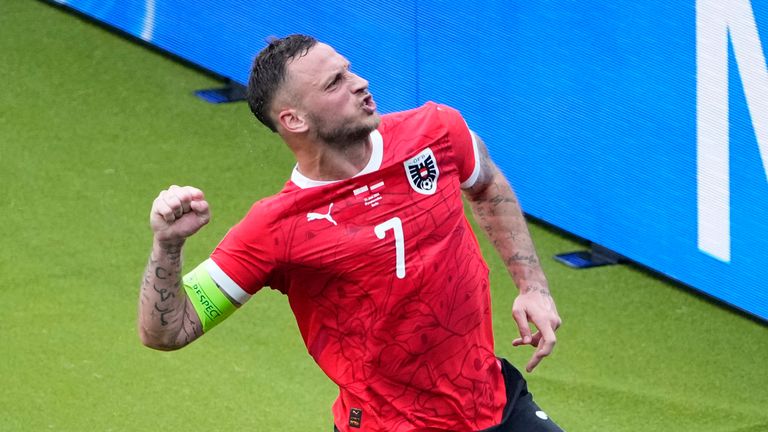 Austria's Marko Arnautovic celebrates after scoring his side's third goal from the penalty spot