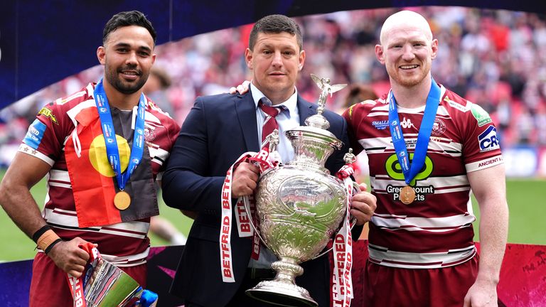 Warrington Wolves v Wigan Warriors - Betfred Challenge Cup - Final - Wembley Stadium
Wigan Warriors head coach Matt Peet (centre) pose with the trophy, player Bevan French (left) with the man of the match trophy, and Liam Farrell celebrate after the final whistle in the Betfred Challenge Cup final at Wembley Stadium, London. Picture date: Saturday June 8, 2024.