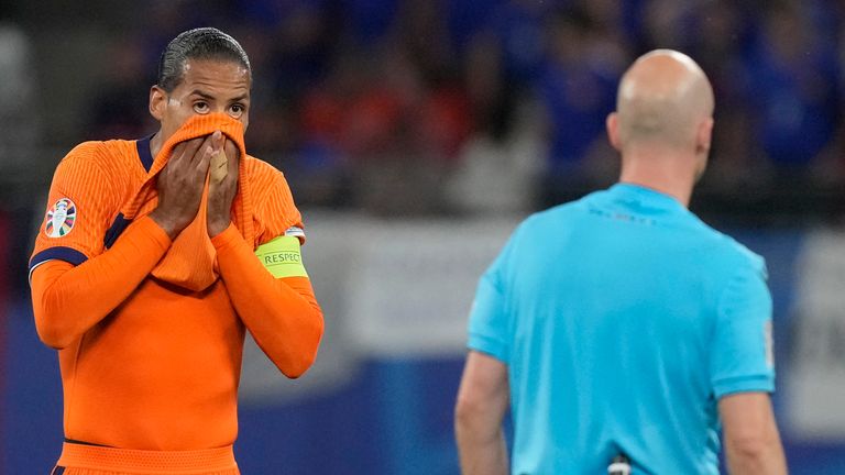 Virgil van Dijk of the Netherlands protest to the referee Anthony Taylor