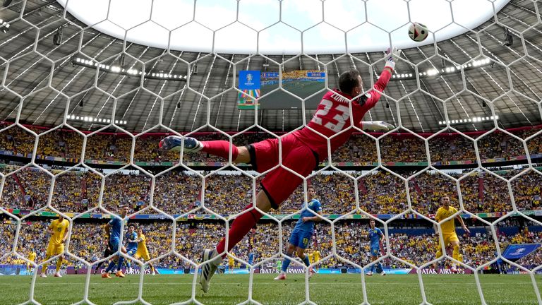 Romania's Nicolae Stanciu, fourth left, scores the opening goal during the Group E match between Romania and Ukraine at the Euro 2024 soccer tournament in Munich, Germany, Monday, June 17, 2024. (AP Photo/Mathias Schrader)
