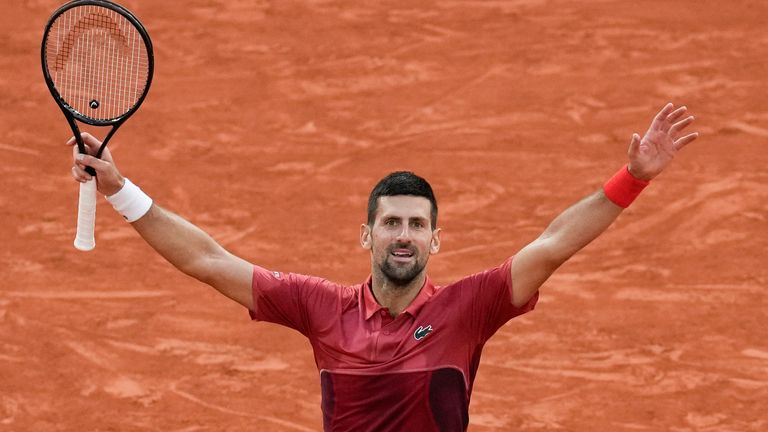 Serbia's Novak Djokovic celebrates winning his fourth round match of the French Open tennis tournament Argentina's Francisco Cerundolo at the Roland Garros stadium in Paris, Monday, June 3, 2024. (AP Photo/Christophe Ena)