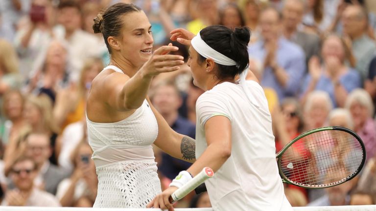 Ons Jabeur of Tunisia is celebrated after winning the Ladies' Singles Semi-finals match against Aryna Sabalenka of Belarus in the Championships, Wimbledon at All England Lawn Tennis and Croquet Club in London, the United Kingdom on July 13, 2023. ( The Yomiuri Shimbun via AP Images )