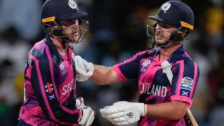 Scotland's captain Richie Berrington, left, and batting partner Chris Greaves celebrate after beating Namibia by 5 wickets