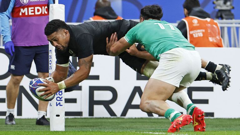 New Zealand's Ardie Savea (L) scores a try in the first half of the 2023 Rugby World Cup quarter-final against Ireland