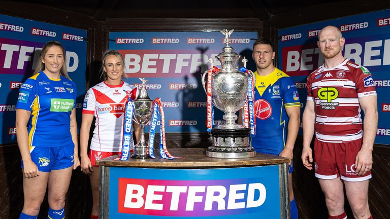 Picture by Alex Whitehead/SWpix.com - 03/06/2024 - Rugby League - Betfred Challenge Cup Final Press Conference - Haydock Park Racecourse, Merseyside, England - Leeds Women’s captain Caitlin Beevers and St Helens Women’s captain Jodie Cunningham, Warrington Men’s captain George Williams and Wigan Men’s captain Liam Farrell pictured with the Betfred Challenge Cup and Women’s Challenge Cup trophies ahead of the finals on Saturday.
