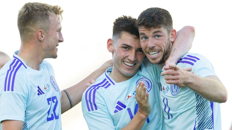 Scotland's Ryan Christie celebrates with Ross McCrorie and Billy Gilmour after scoring to make it 1-0 against Gibraltar
