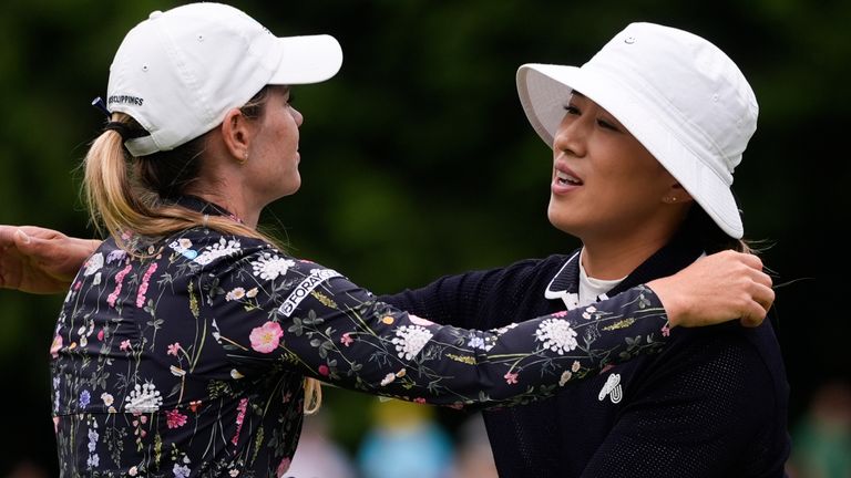 Sarah Schmelzel, left, greets Amy Yang, of South Korea, after finishing at the 18th hole in the third round of the Women's PGA Championship golf tournament at Sahalee Country Club, Saturday, June 22, 2024, in Sammamish, Wash. (AP Photo/Lindsey Wasson)